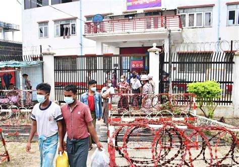 A released prisoner, right, is welcomed by her colleague after she was released from Insein Prison Sunday, Jan. 4, 2026, in Yangon, Myanmar. (AP Photo/Thein Zaw)