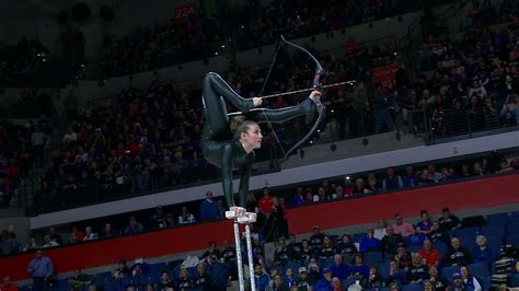 Halftime act shoots bow and arrow with her feet - ESPN Video