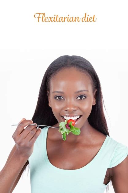 The word flexitarian diet against smiling young woman having a snack ...