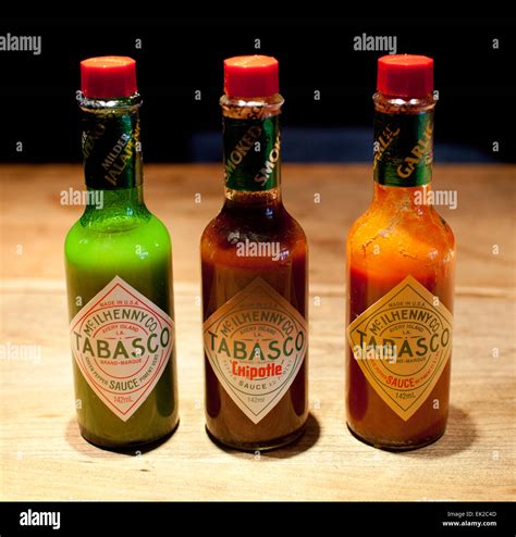 Bottles of Tabasco sauce. Jalapeño-based green, chipotle-based smoked ...