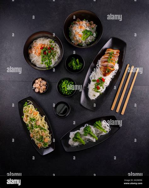 Various dishes of Asian cuisine with different types noodles and rice ...