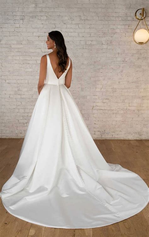 7755 | Stella York | Modern Luxe Ballgown Wedding Dress with Deep V-Neckline | Essense Designs