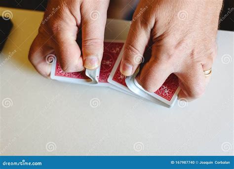 Hands of Magician Shuffling a Deck of Poker Cards before Doing a Trick ...