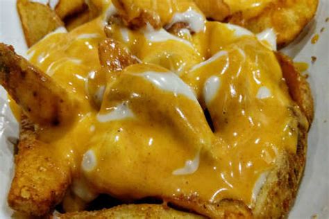 Cheesy Potato Wedges Recipe: How to Make Cheesy Potato Wedges Recipe ...