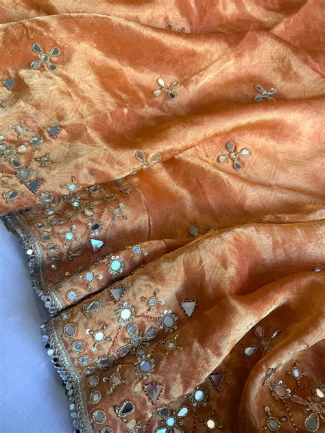 Dhup chao effect kesari orange tanchui tissue silk mirrorwork hand emb ...