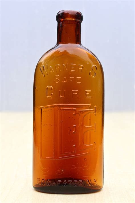 VINTAGE WARNER''S ROCHESTER NY AMBER 1/2 PINT PICTORIAL SAFE CURE ...