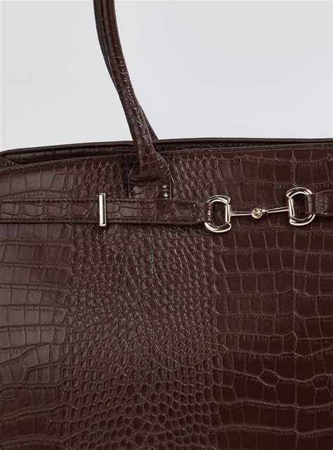 Buy Women Textured Shoulder Bag Online at just Rs. 1299.0 ...