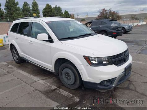 Report 3C4PDCGG7HT594737 DODGE JOURNEY 2017 White Flexible Fuel - price and damage history