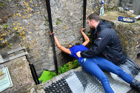 Kissing the Blarney Stone - A Walk in the World - Blarney Castle in Cork
