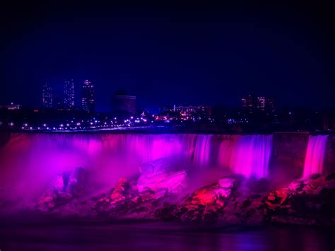 Download wallpaper 4527x3399 night city, waterfall, lights, stones ...