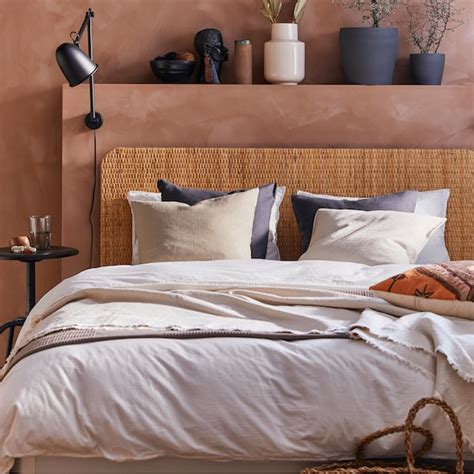 A bedroom with pink hues and natural materials - IKEA