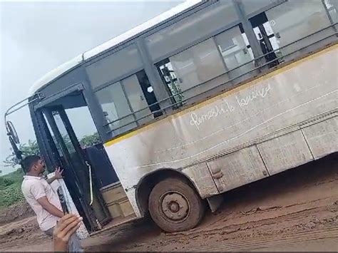 People trudge through the muddy road
