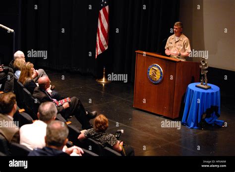 The Master Chief Petty Officer of the Navy addresses guests at a book ...