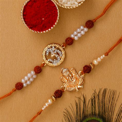 Om & Ganpati Pack of 2 Religious Rudraksh Rakhis and Roli Chawal Pack ...