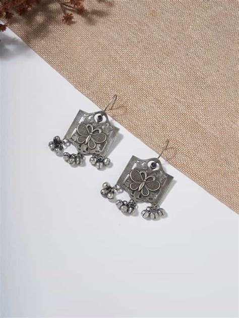 Silver-toned handcrafted brass accessories to shop online from the Loom