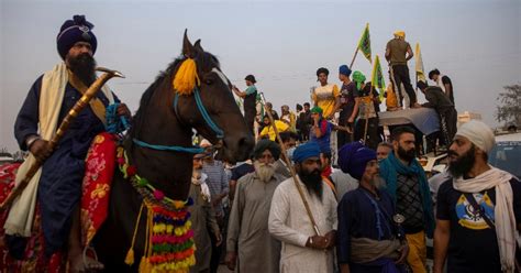 Dressed In Their Tradition Attire And Arms, Nihang Sikhs On Horsebacks ...