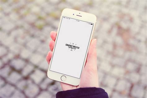 Female Hand holding iPhone 6 Mockup - Mockup World