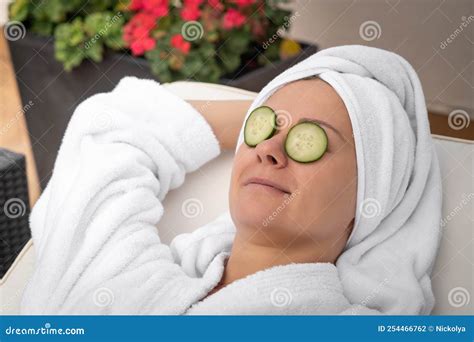 Young Woman Getting Eye Nature Treatment by Cucumber at Luxury Spa ...