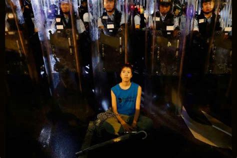 Hong Kong police draw guns, arrest 36 in latest protest
