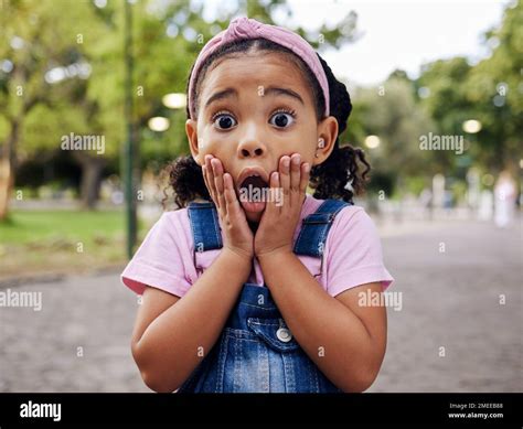 Wow, surprise and girl child at park outdoors looking shocked. Face ...