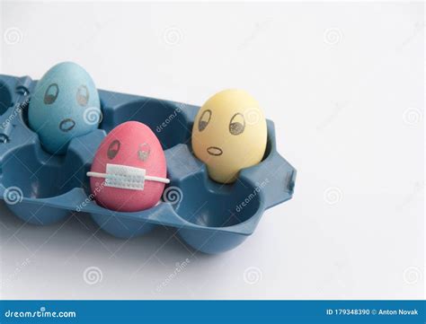 Close Up View of Pink Chicken Egg with Face with Drawn Medical Face ...