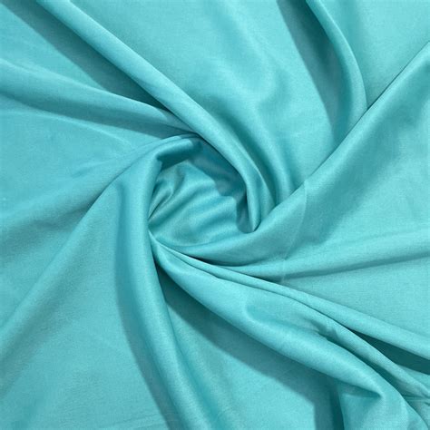 Buy Turqousie Green Solid Lycra Dyed Fabric Online – TradeUNO Fabrics