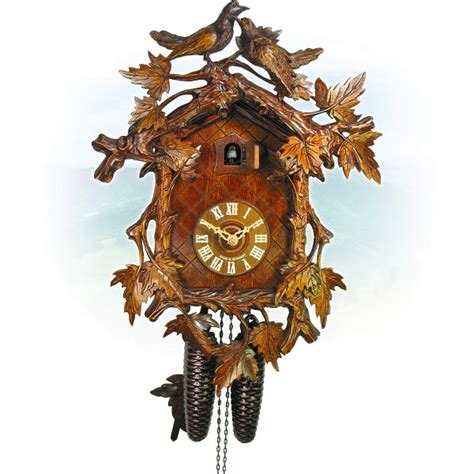 Cuckoo clocks with carvings and carved figures