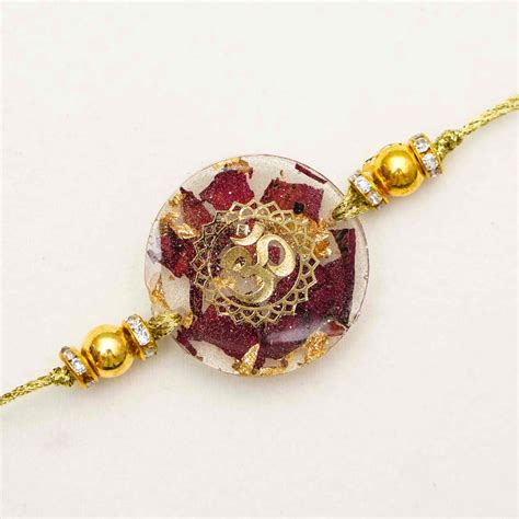 Buy Handmade Resin Round Om Preserved Flower Rakhi With Roli Chawal ...