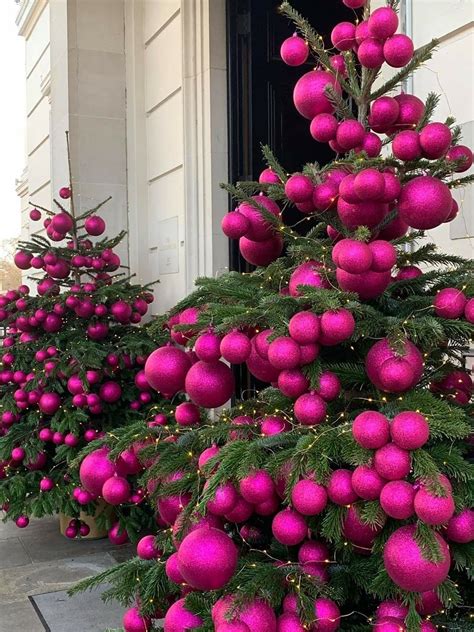 Pink Christmas Ornaments Displayed Outside House