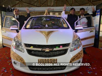 Indian visitors admire the gem studded 'Vibrant Gujarat Jewellery Car ...
