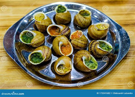Helix Aspersa Muller, Maxima Snail. Edible Snails with Butter and Seasonings Stock Photo - Image ...