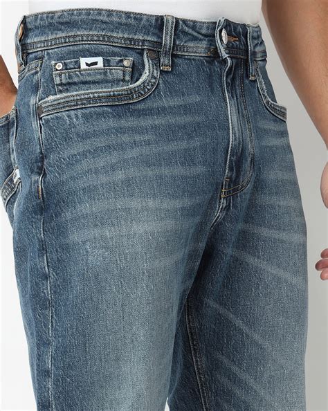 Nico Tapered Fit Mid Rise Mid Wash Blue Jeans