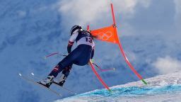 United States' Lindsey Vonn crashes into a gate during an alpine ski women's downhill race, at the 2026 Winter Olympics, in Cortina d'Ampezzo, Italy, Sunday, Feb. 8, 2026. (AP Photo/Jacquelyn Martin)
