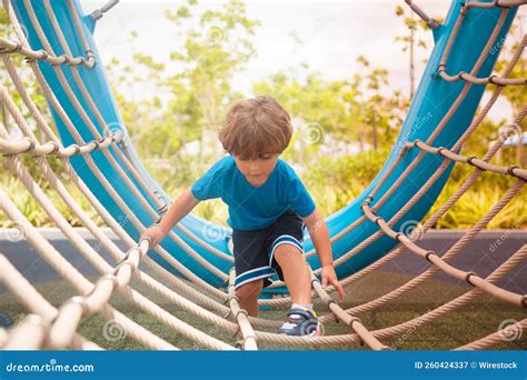 Little Caucasian Boy Climbing in a Playground in Baker Park in Naples ...