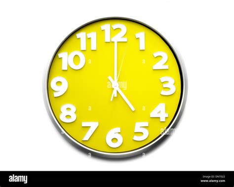 yellow clock face 5 o'clock the clock strikes five 1700 hours Stock ...
