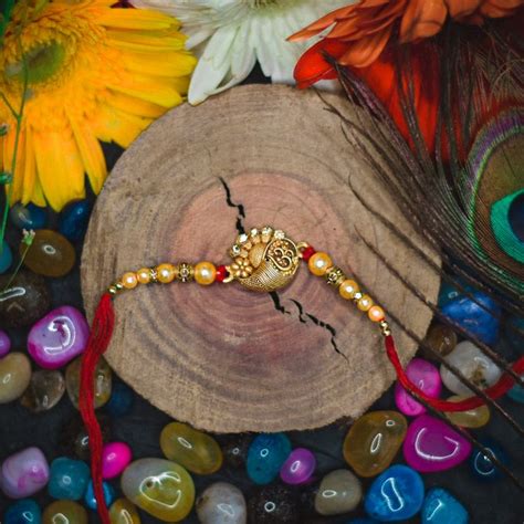 Send Om Divine Rakhi With Kaju Katli Online