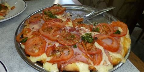 Cuánto sale una pizza grande de muzzarella en El Palacio de la Pizza en ...