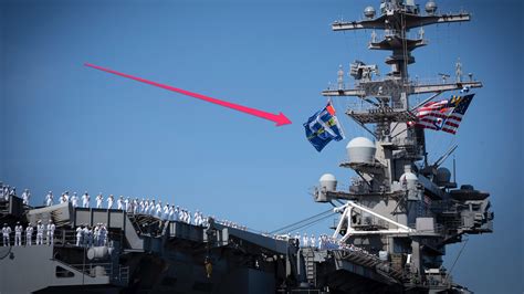 USS George H.W. Bush aircraft carrier flies battle flag on return home