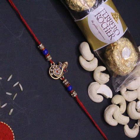 Send Ganesha Blessing Rakhi with Cashews and Ferrero Rocher Online