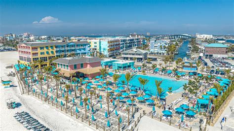 A Beach With Many People And Buildings