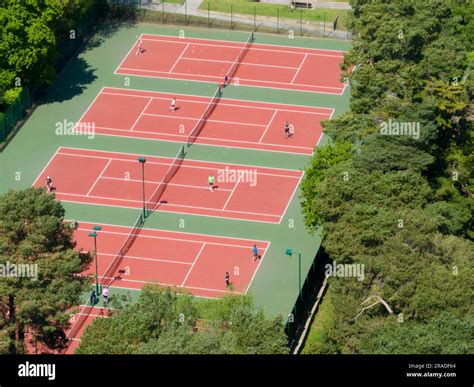 Aerial view of a red clay court tennis courts Stock Photo - Alamy