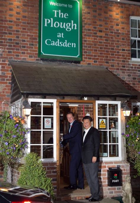 Drinks are on me! Xi, Cameron enjoy pub night out - Rediff.com India News