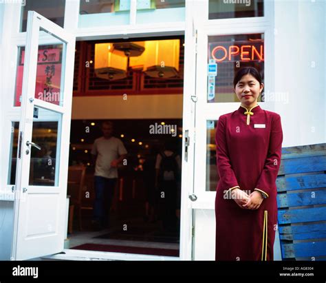 Welcoming girl at a Chinese restaurant Soho London Stock Photo - Alamy
