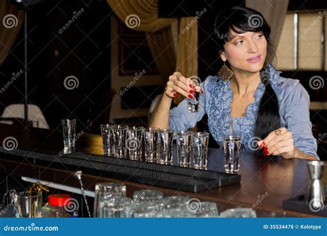 Vodka Shots Lighted With Aqua Light Filled With Alcohol On Glass Bar ...