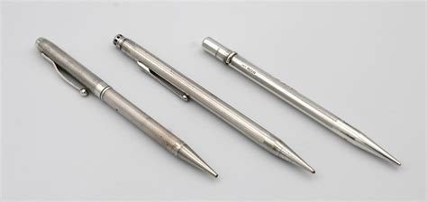 Lot - Two silver propelling pencils, one with reversible biro section ...