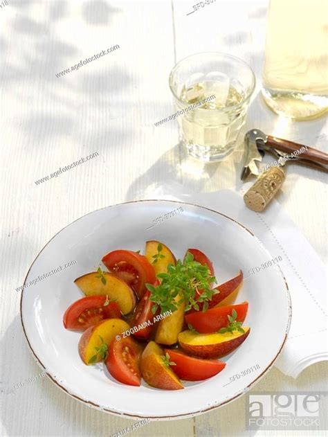 Peach and tomato salad with curry dressing, Stock Photo, Picture And ...