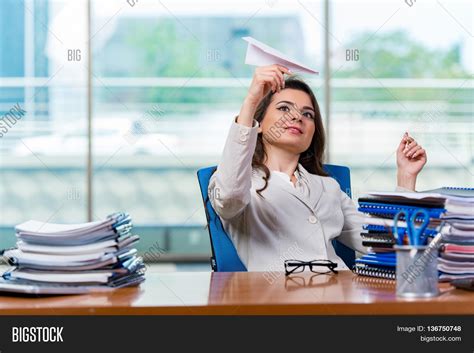 Businesswoman Sitting in Office Stock 的图像结果