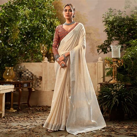 Cream Woven Pure Cotton Saree With Tassels