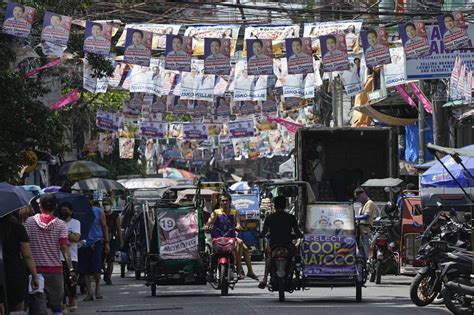 菲律宾首都马尼拉开启选举工作 街头挂满竞选海报-搜狐大视野-搜狐新闻