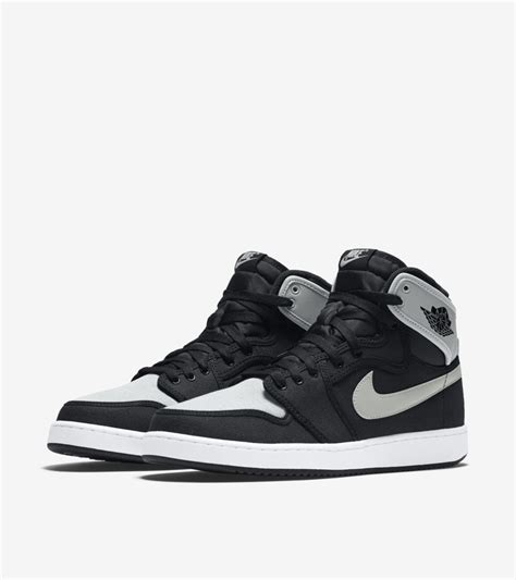 grey black and white nike jordans